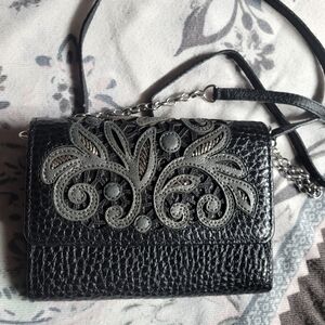 Elegant Black Leather Bag with Intricate Design